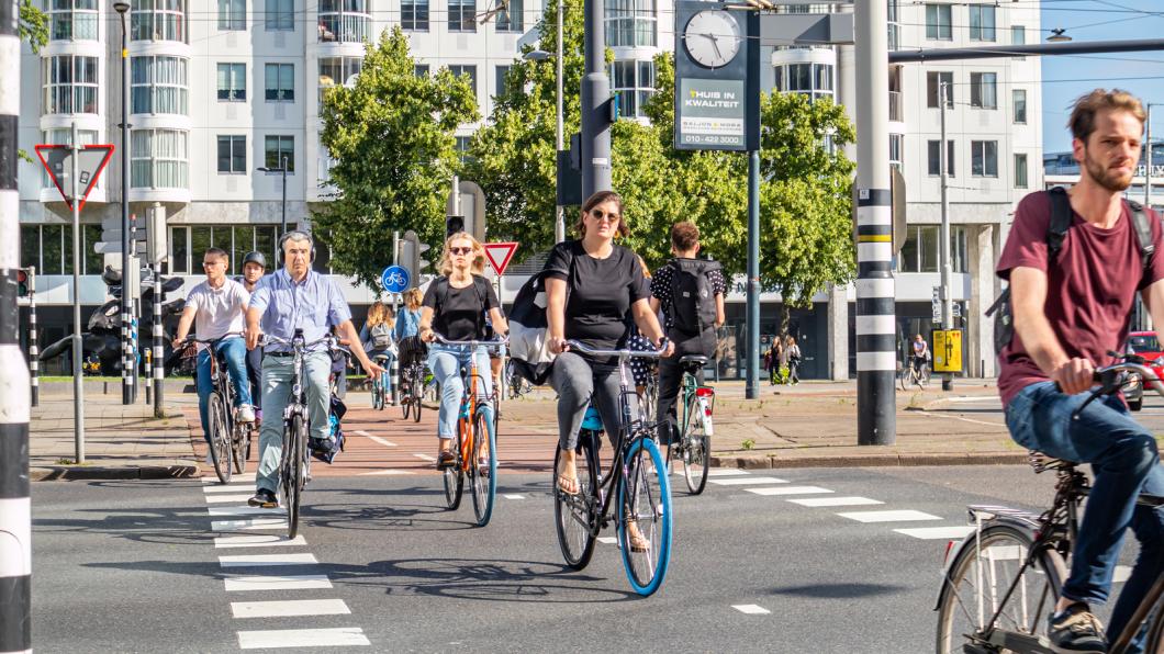 bigstock-People-Riding-Bikes-In-The-Cit-315351001.jpg